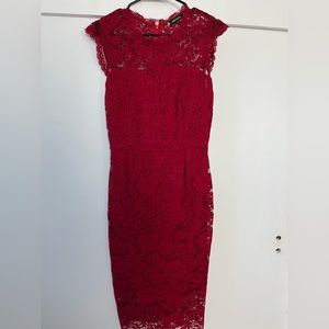 Wine red, form-fitting, lace dress.